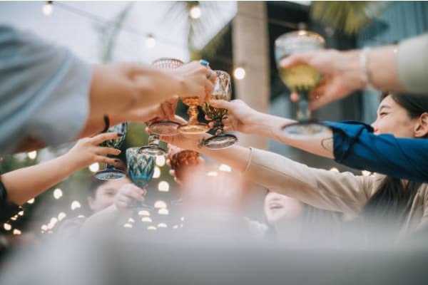a group of people sitting at a table with drinks